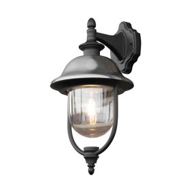 Parma Noir lampe d’extérieur De Konstsmide - Avec sa surface noire robuste et son abat-jour en verre transparent, il émet une lumière chaleureuse et invitante, créant une atmosphère accueillante à l'entrée ou sur la terrasse.