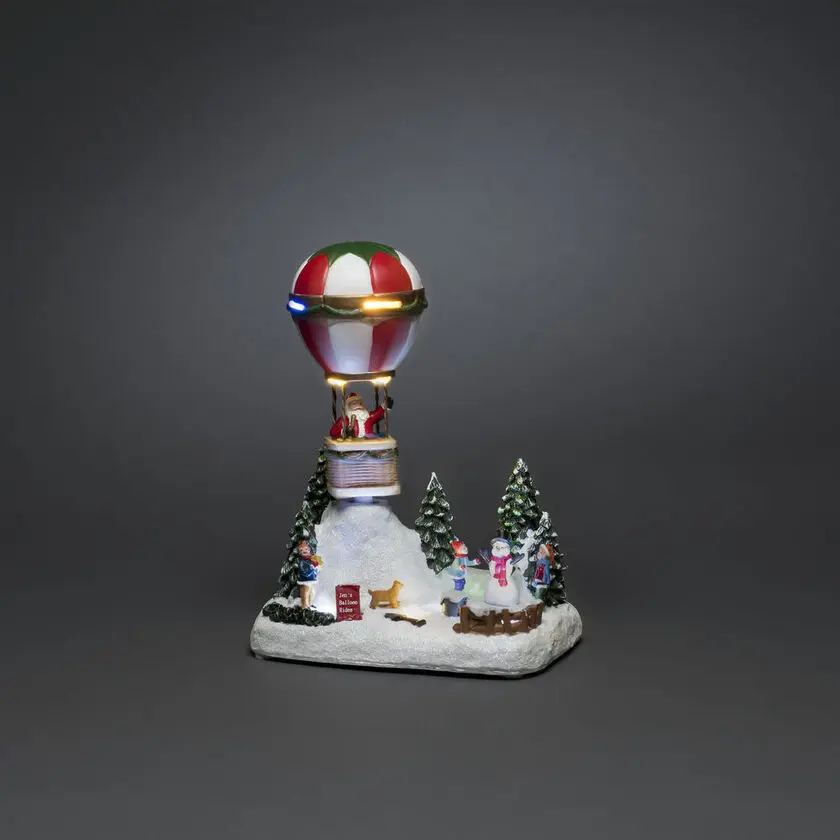 Décoration De Noël Mécanique Avec Montgolfière Multicolore De Konstsmide - Entrez dans l'esprit de No&euml;l avec cette d&eacute;coration de No&euml;l m&eacute;canique imaginative : une montgolfi&egrave;re avec le P&egrave;re No&euml;l flottant au-dessus d'un paysage hivernal !