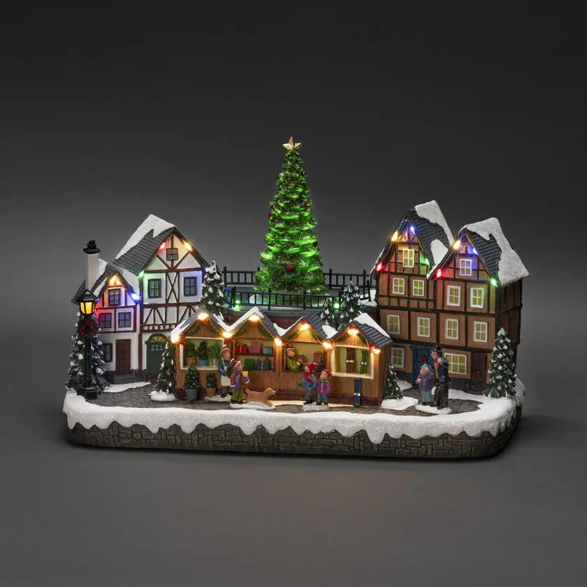 Décoration De Noël Mécanique Avec Marché De Noël 24cm Multicolore De Konstsmide - Avec 28 lumi&egrave;res LED blanc chaud, des maisons enneig&eacute;es, des &eacute;tals de march&eacute; color&eacute;s et un majestueux sapin de No&euml;l au centre, il diffuse &agrave; la fois lumi&egrave;re et musique.