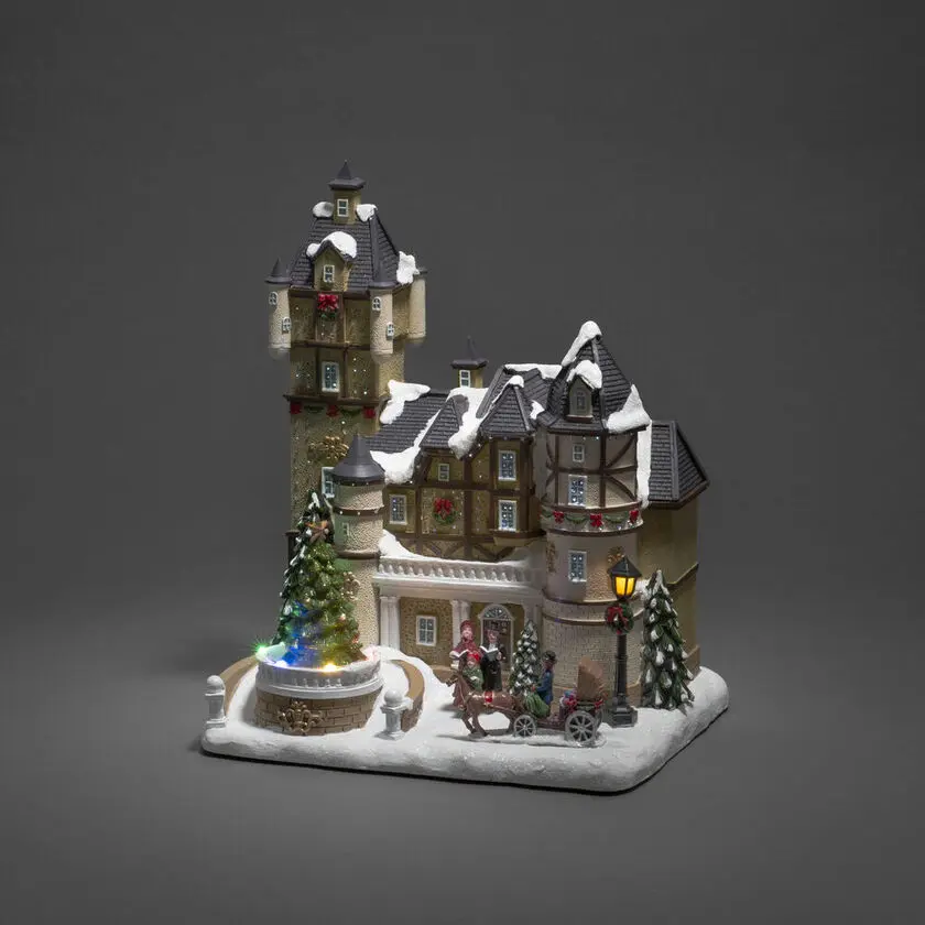 Maison À Fibre Optique Multicolore De Konstsmide - Avec des lumi&egrave;res LED &eacute;tincelantes, de beaux d&eacute;tails et de la musique int&eacute;gr&eacute;e, il diffuse &agrave; la fois la lumi&egrave;re et la joie de No&euml;l.