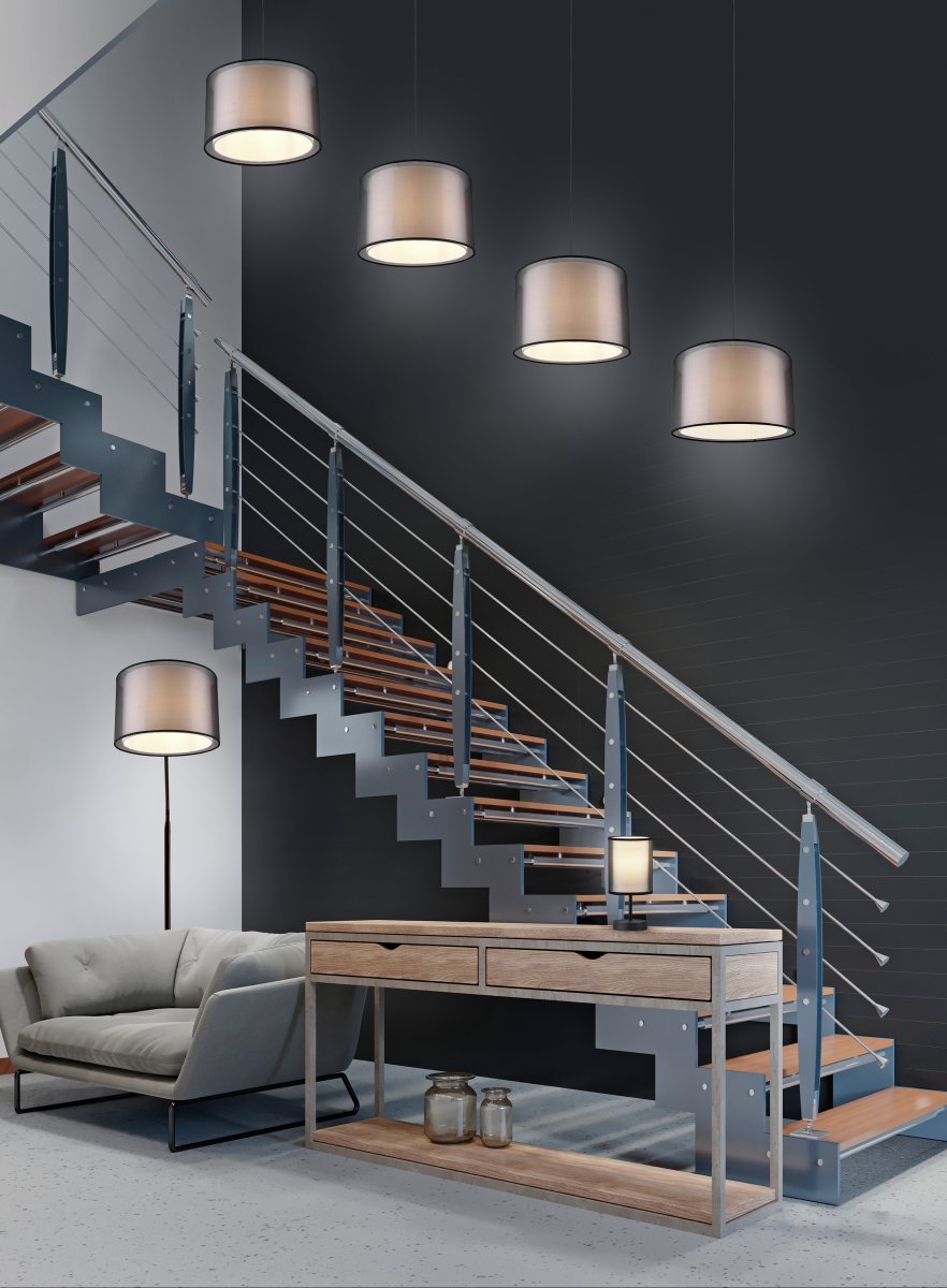 Burton Noir lampadaire De Trio Lighting - La combinaison moderne d'un abat-jour intérieur en tissu blanc et d'un abat-jour extérieur en plastique noir transparent semble à la fois individuelle et rafraîchissante et peut être intégrée dans les espaces de vie modernes.