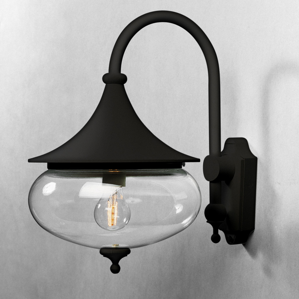 Libra Noir lampe d’extérieur De Konstsmide - Les formes douces et le grand abat-jour en verre transparent diffusent une lumière chaude et agréable, créant une atmosphère accueillante dans les entrées ou sur les terrasses.