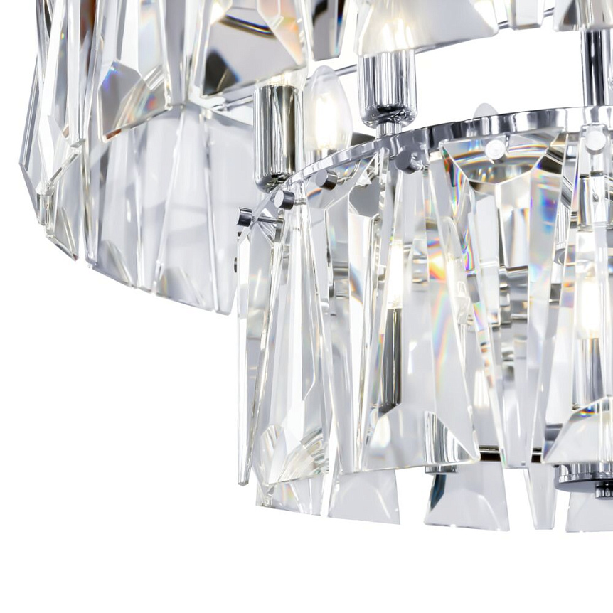 Puntes Ø68 Chrome cristal De Maytoni - Puntes est un &eacute;l&eacute;gant lustre de plafond en m&eacute;tal chrom&eacute; avec des prismes &eacute;tincelants qui entourent les sources lumineuses et cr&eacute;ent un jeu de lumi&egrave;re magique lorsque la lampe est allum&eacute;e.