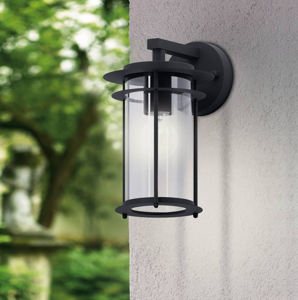 Valdeo Noir lampe d’extérieur De Eglo - La lampe est dot&eacute;e d'un cadre &eacute;l&eacute;gant en acier galvanis&eacute; noir et d'un cylindre en verre transparent qui entoure la source lumineuse, offrant un &eacute;clairage agr&eacute;able et invitant.