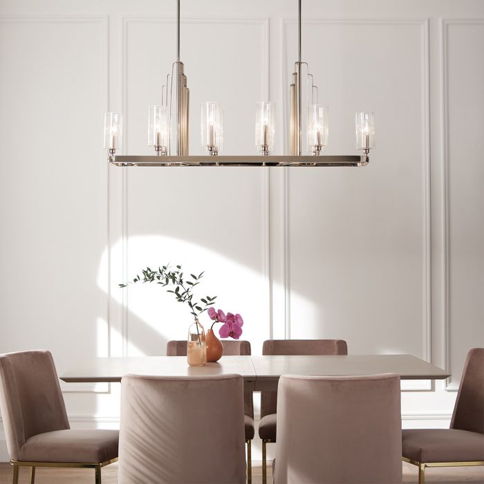 Kimrose 114cm Nickel suspension De Elstead Lighting - Les abat-jour cylindriques en verre sont transparents et présentent des rainures verticales, créant un effet d'éclairage unique et subtil.
