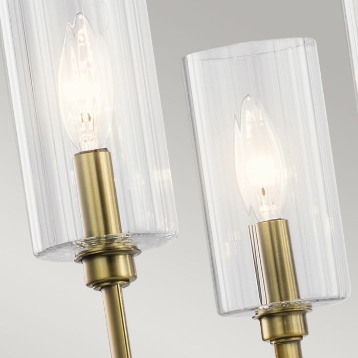 Kimrose Ø68 Laiton brossé suspension De Elstead Lighting - Les abat-jour cylindriques en verre sont transparents et présentent des rainures verticales, créant un effet d'éclairage unique et subtil.