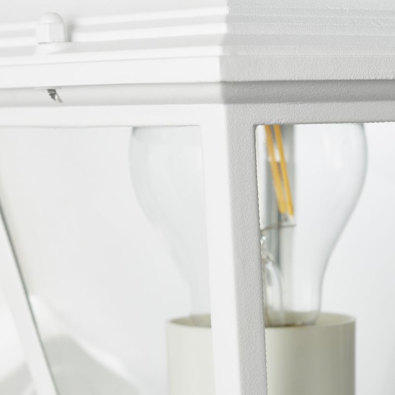 Nissie Blanc lampe d’extérieur De Brilliant - Son design décoratif permet à la lumière de se fondre naturellement dans la façade de la maison.